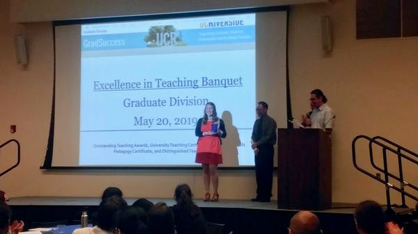 Photo of Elizabeth receiving a teaching award